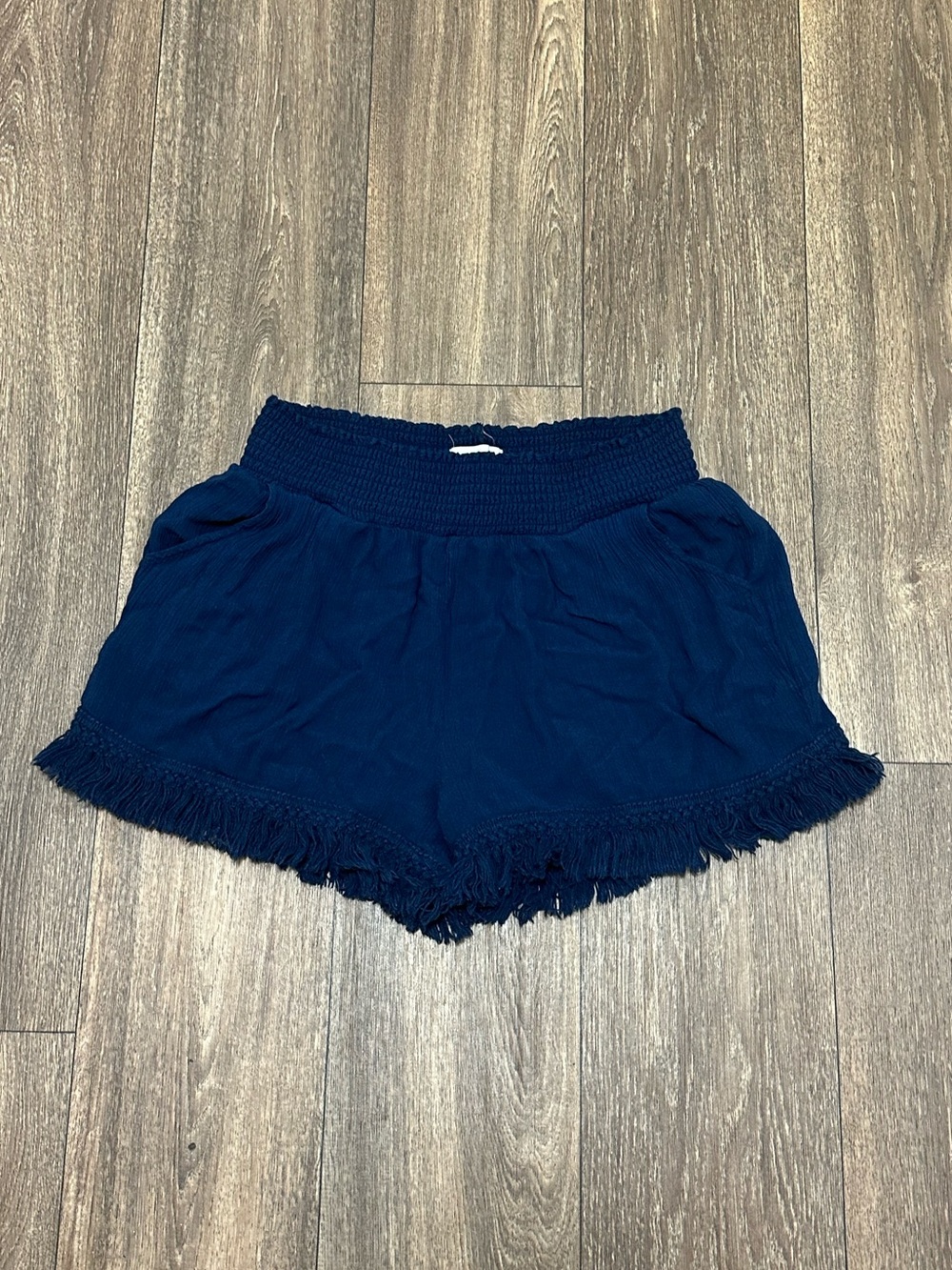 White Crow Navy Smocked Waist Fringe Hem Shorts